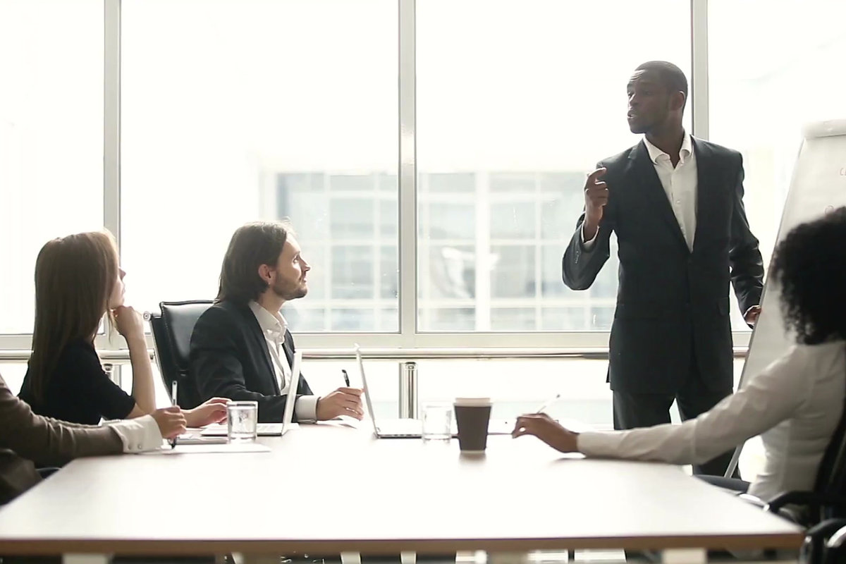 Consulting team reviewing a process-improvement project in a boardroom